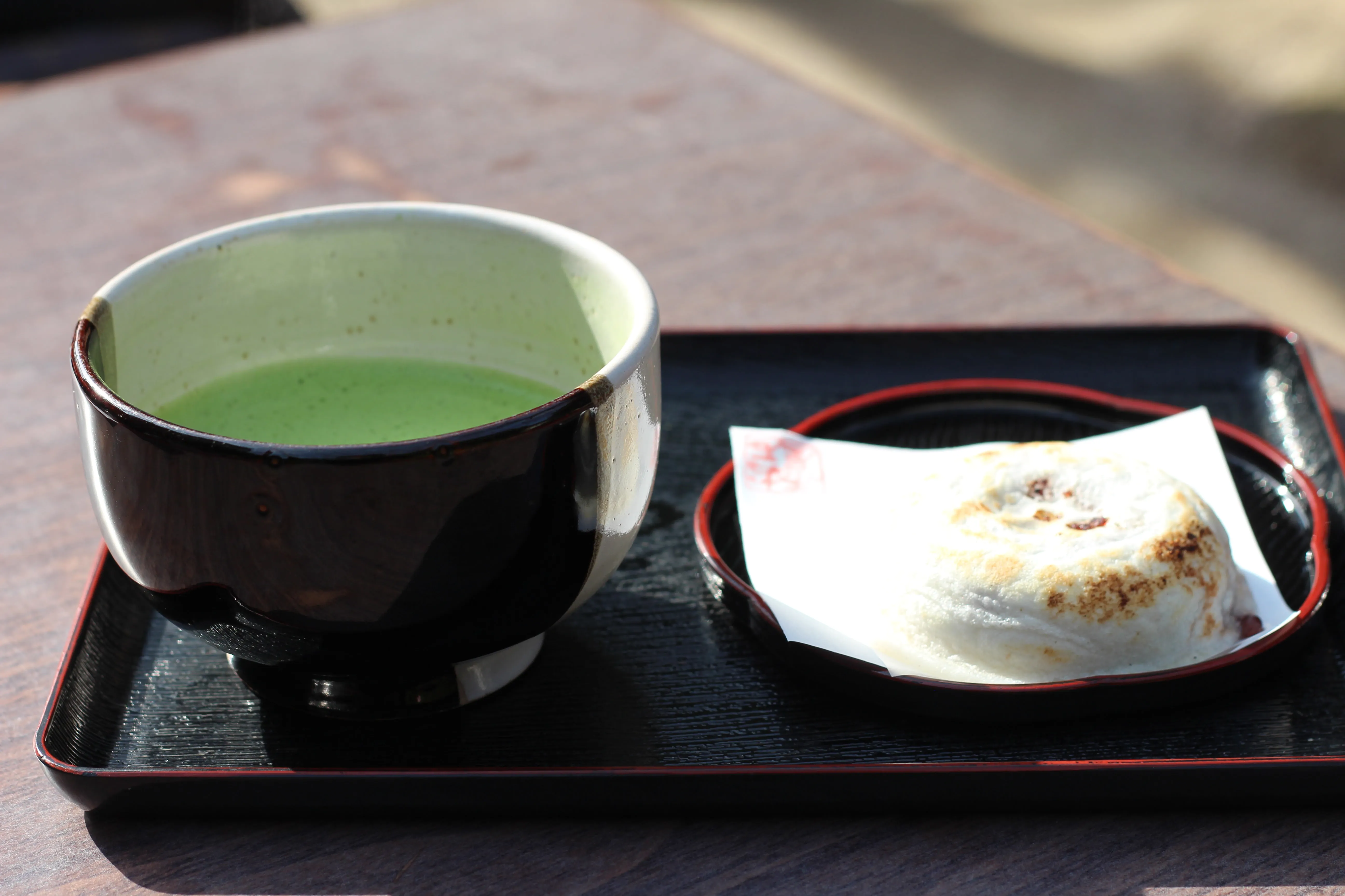 Umegaemochi rice cake with plum-blossom stamp, served with matcha tea